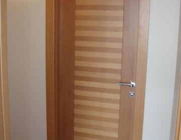 Solid wood door crafted with cherry & maple stripes