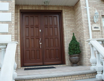 Custom designed 8' tall double door in Mahogany finish with fingerprint access