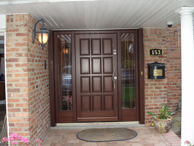 New Front door in Dark Mahogany, custom designed and crafted in Austria, equipped with Fingerprint access