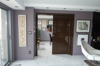 Double pocket door transforms living room into a bedroom 
