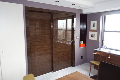 Double pocket door transforms living room into a bedroom