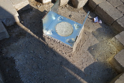 Aluminum brackets attached to 3' deep concrete footings