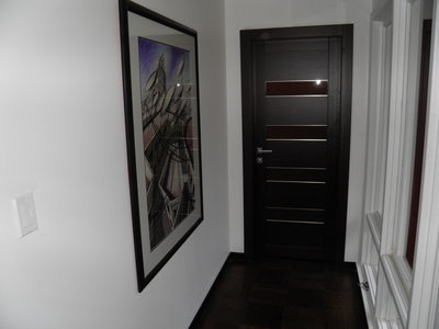 Master bedroom door in solid oak wenge with smoked frosted glass