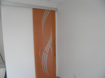Glass door sliding on wall, orange color, frosted decor SERENA, aluminum track