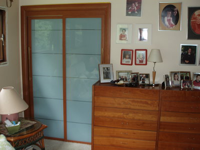 Master closet parallel sliding closet doors with Bianco Marina glass 