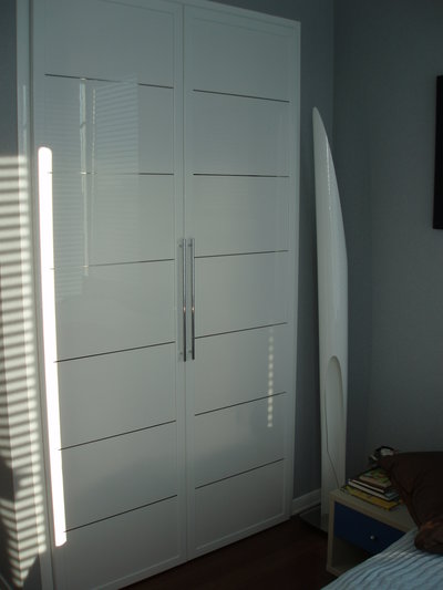 Custom closet doors in glossy white finish from MIRIA collection
