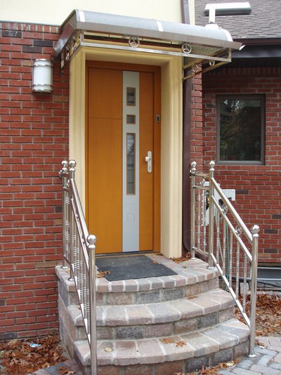 High-end door leads to the backyard (outside view), custom designed by Bella Porta, crafted in Austria, oak finish, 2 insulated glasses, fingerprint access