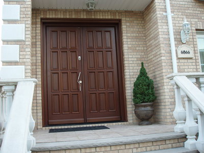 Custom designed 8' tall double door in Mahogany finish with fingerprint access